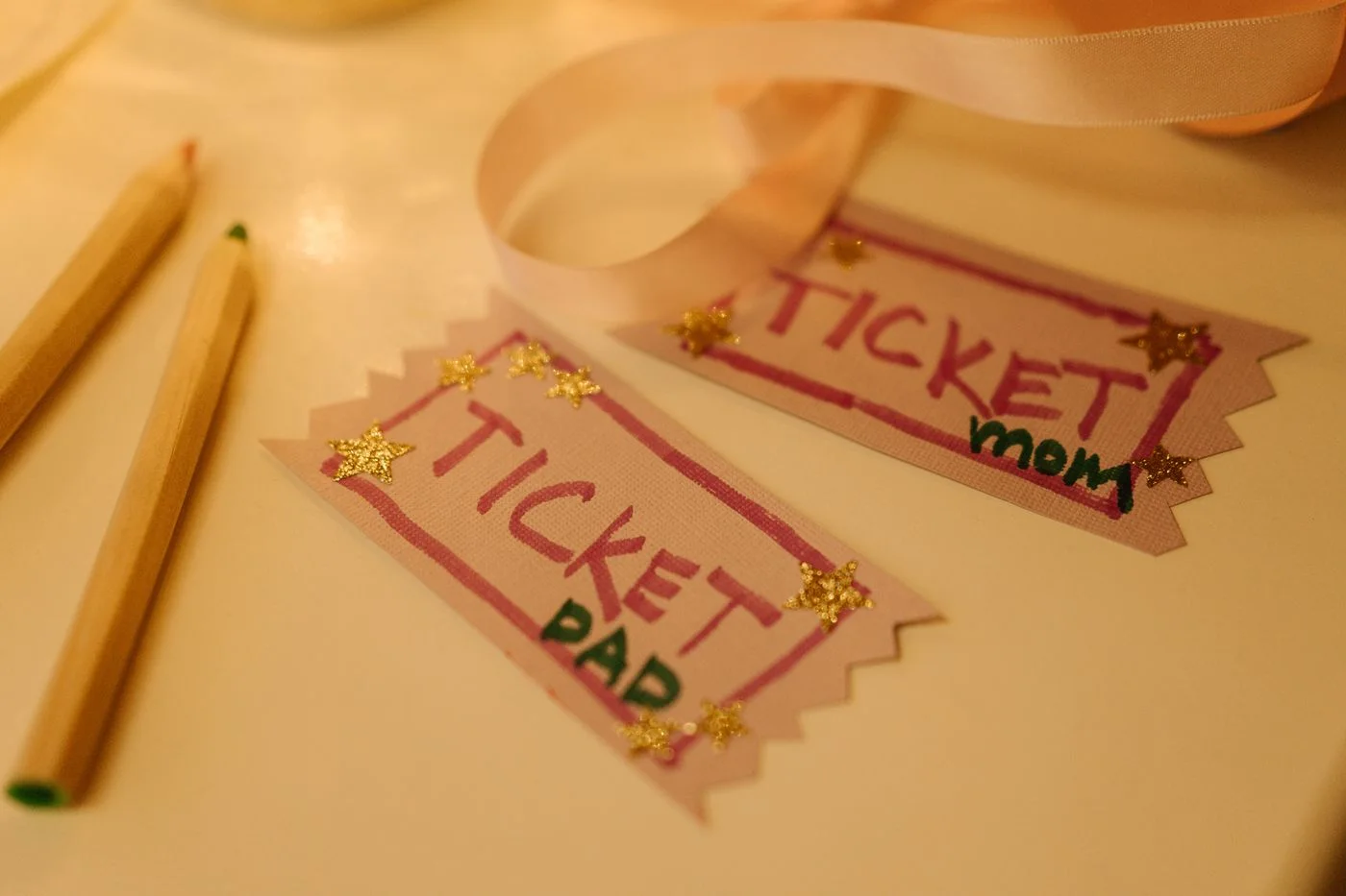 Handmade paper experience tickets arranged on a craft table.
